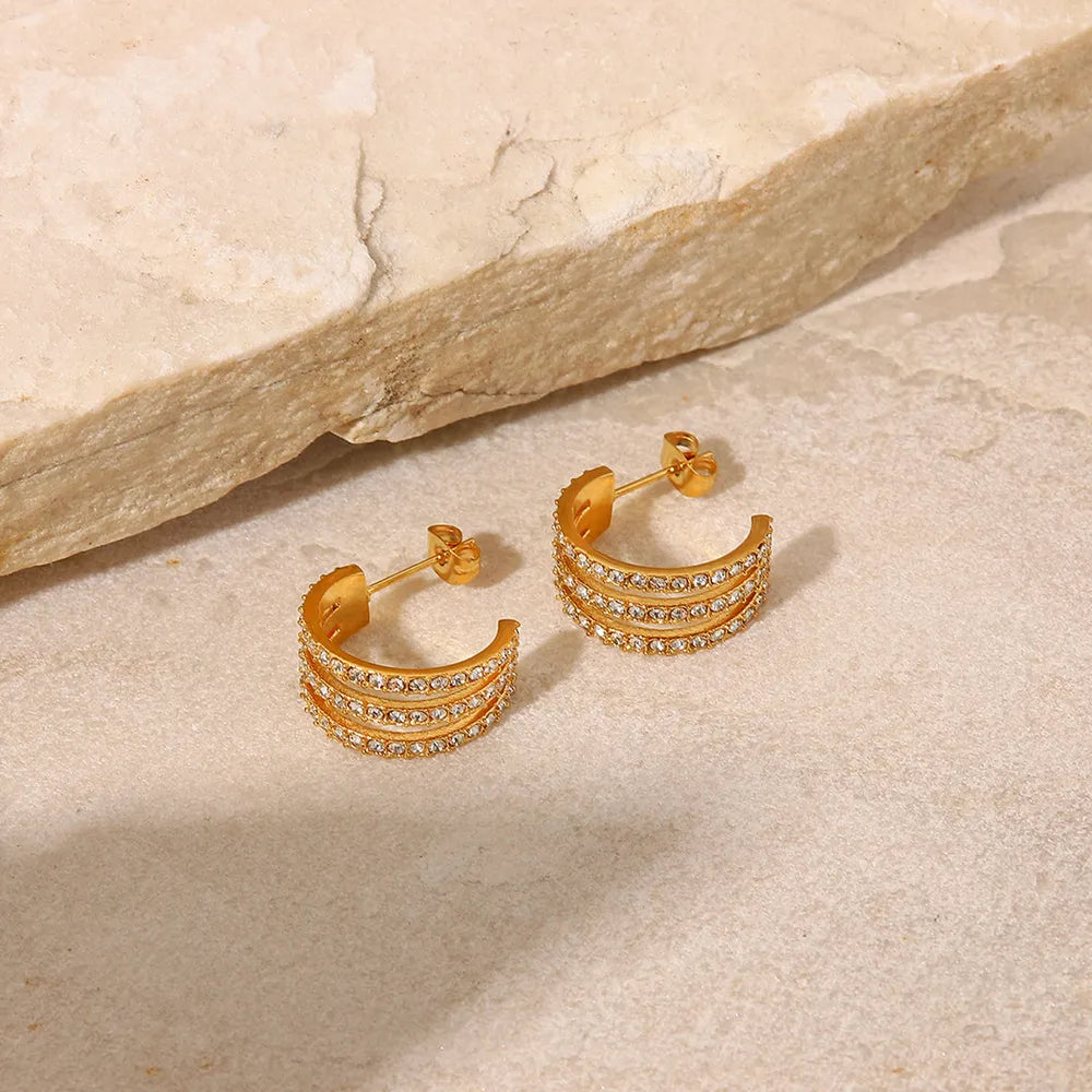 Stainless Steel Inlaid Zircon C-Hoop Earrings — styled flat lay, earrings